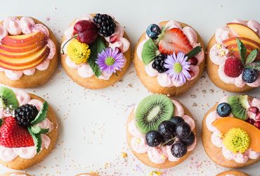 Assorted donuts top of white area in Cheapest price